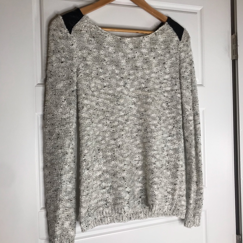 White, black, and silver thread sweater
